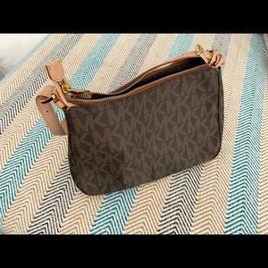 Vintage Michael Kors purse. Brown with beige strap. Like new. Rarely used.